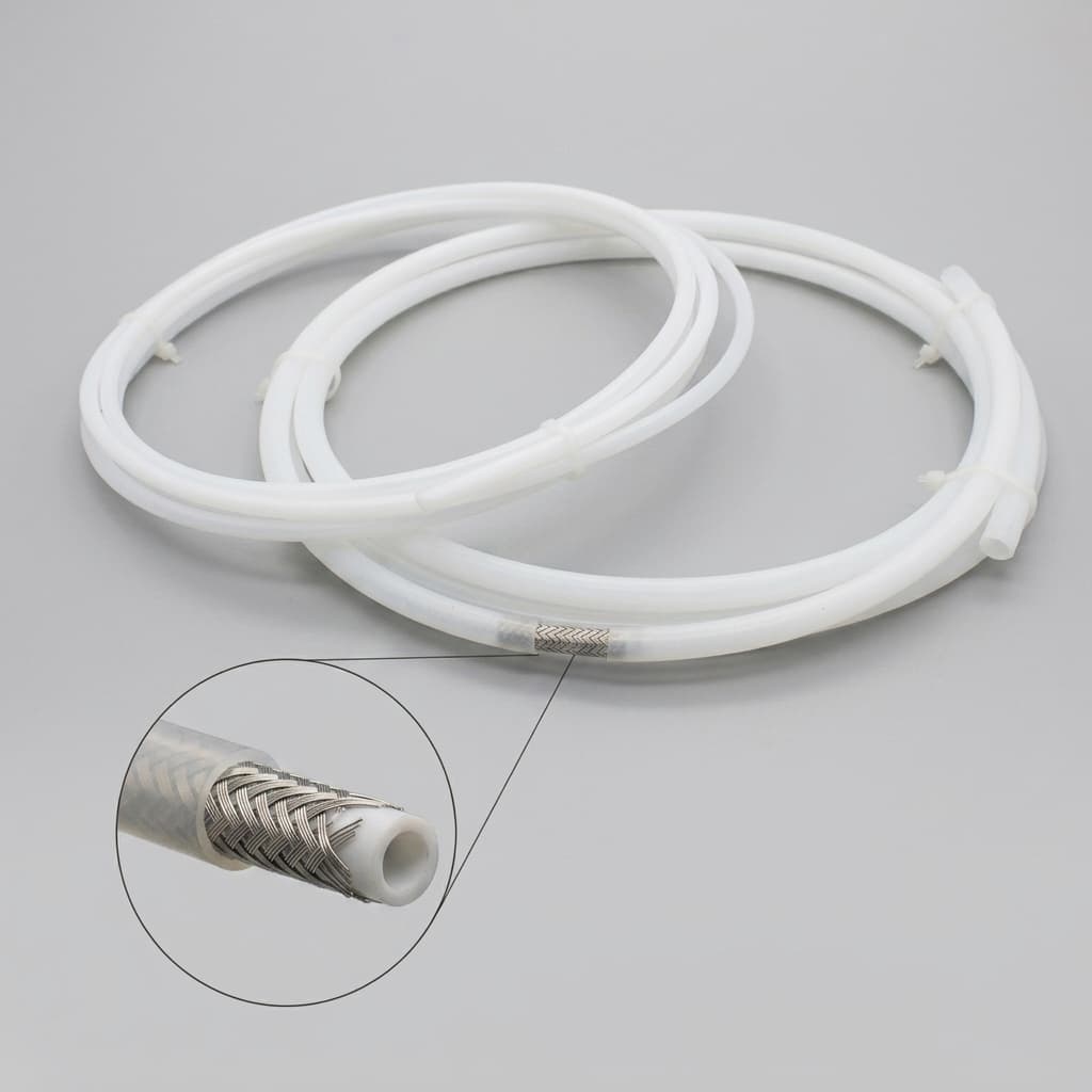 PTFE lined reinforced catheter tube for guidewire compatible devices